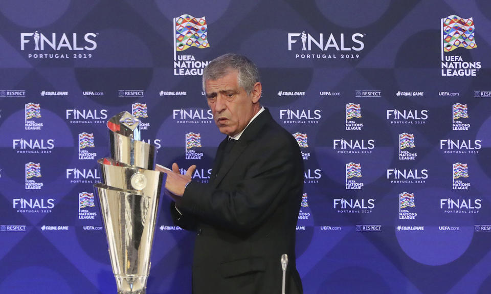 Portugal soccer team manager Fernando Santos from left, stands up during a press conference after the UEFA Nations League Finals draw at the Shelbourne Hotel, Dublin, Monday Dec. 3, 2018. (Niall Carson/PA via AP)