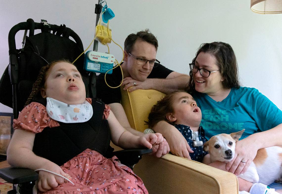 Evan and Jennifer Emerson are photographed with their children, Evangeline, 8, and Malachi, 6, and dog, Penny, at their home in Raleigh, N.C. on Thursday, July 13, 2023. The Emersons recently bought the home using Ownify, a fractional homeownership program. Through the program, homebuyers make a two percent down payment, then pay a fixed monthly payment to Ownify and a monthly occupancy payment on the fraction of the home that is not yet owned.