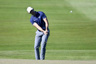 Cameron Tringale hits his third shot on the 18th hole of the North Course during the second round of the Farmers Insurance Open golf tournament, Thursday Jan. 27, 2022, in San Diego. (AP Photo/Denis Poroy)