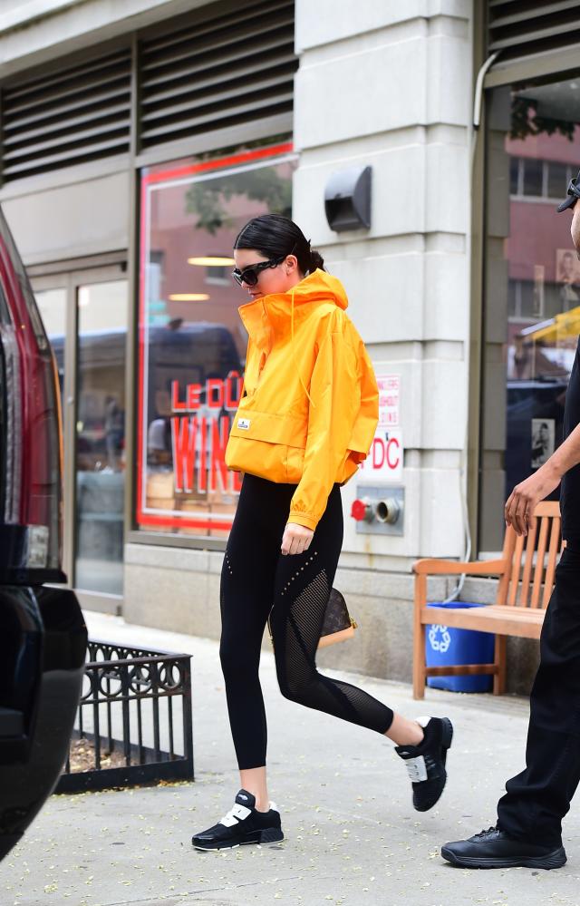 Kendall Jenner wearing Black Leather Biker Jacket, Black Cropped Top, Black  Leggings, Black Athletic Shoes