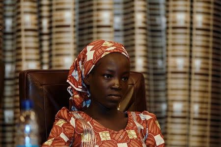 Amina Ali Darsha Nkeki, a Nigerian schoolgirl rescued after over two years of captivity with Boko Haram militants, looks on while visiting President Muhammadu Buhari in Abuja, Nigeria May 19, 2016. REUTERS/Afolabi Sotunde