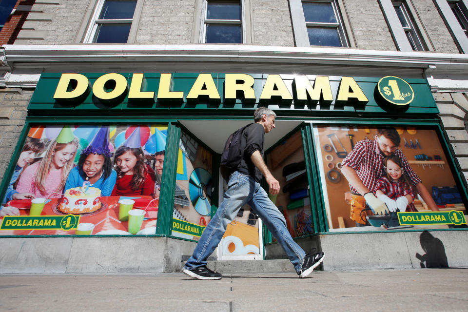 A pedestrian walks past a Dollarama store in Ottawa, Ontario, Canada, September 1, 2016. REUTERS/Chris Wattie