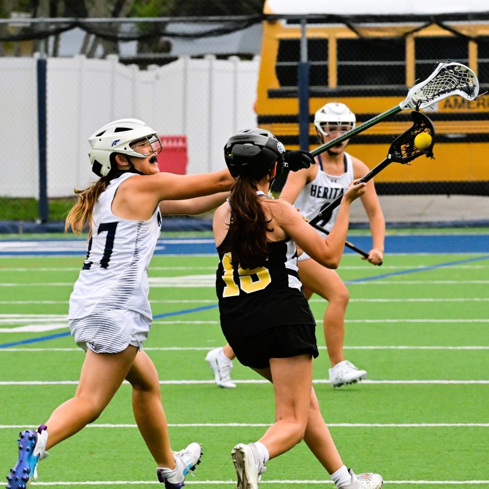 American Heritage-Delray's Bailey Bostley tried to jostle the ball free from an American Heritage-Plantation player's possession during the Stallions' regional semifinals win on April 30, 2024.