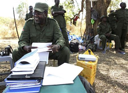 South Sudan's rebel leader Riek Machar sits in the bush in a rebel-controlled territory in Jonglei State January 31, 2014. REUTERS/Goran Tomasevic