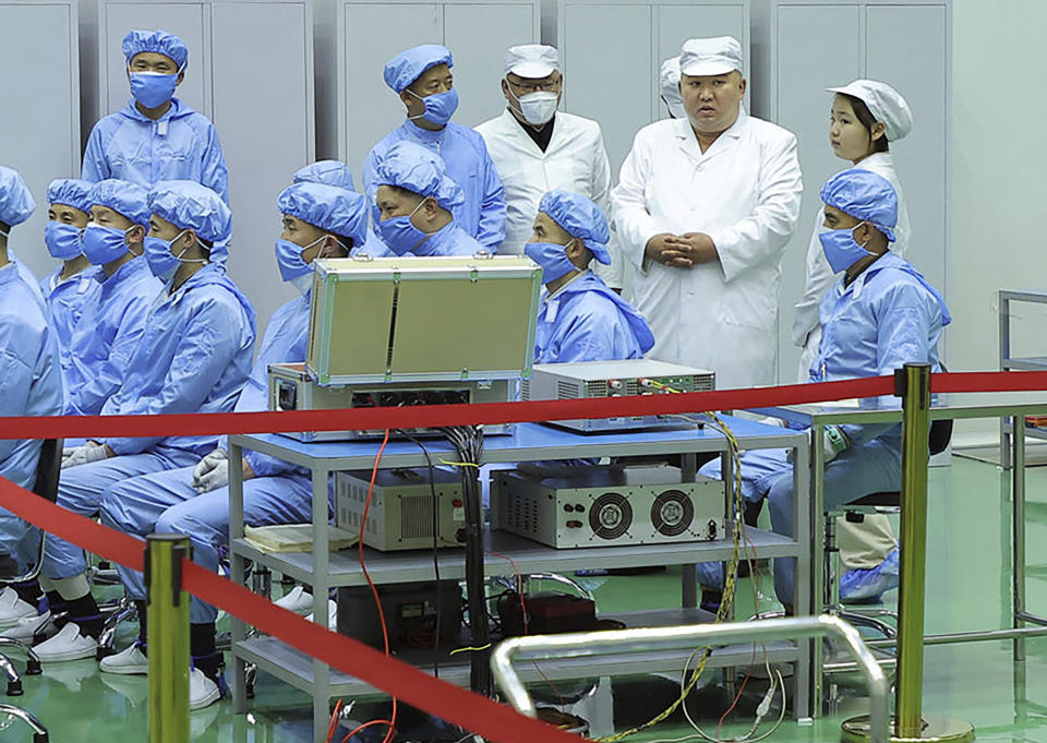 In this photo provided by the North Korean government, North Korean leader, Kim Jong Un, second right, and his daughter, right, visit the country's aerospace agency North Korea Tuesday, May 16, 2023. Kim has examined a finished military spy satellite that his country is expected to launch soon. State media said he did so Tuesday during a visit to his country’s aerospace agency where he described space-based reconnaissance as crucial for countering the U.S. and South Korea. Independent journalists were not given access to cover the event depicted in this image distributed by the North Korean government. The content of this image is as provided and cannot be independently verified. (Korean Central News Agency/Korea News Service via AP)