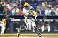 CORRECTS TO LUIS URIAS FLYING OUT, INSTEAD OF WILLY ADAMES HOMERING - Milwaukee Brewers' Luis Urias flies out during the first inning of the team's baseball game against the Miami Marlins, Saturday, May 14, 2022, in Miami. (AP Photo/Lynne Sladky)