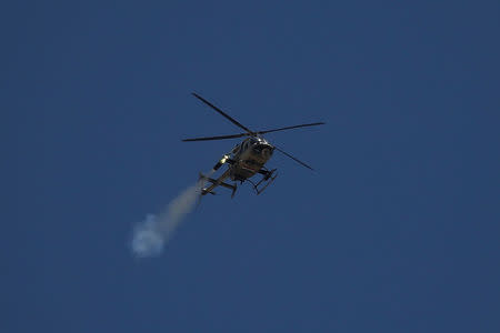 An Iraqi Army helicopter launches a missile against Islamic State positions in western Mosul, Iraq June 4, 2017. REUTERS/Alkis Konstantinidis