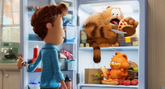 Jon Arbuckle, Garfield’s dad Vic (voiced by Samuel L. Jackson) and Garfield (voiced by Chris Pratt) in 2024's "The Garfield Movie."