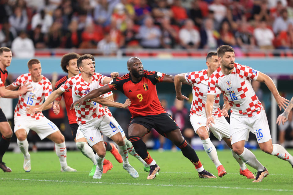 DOHA, QATAR - DECEMBER 01: Romelu Lukaku of Belgium and Ivan Perisic of Croatia anticipate the ball dropping into the box during the FIFA World Cup Qatar 2022 Group F match between Croatia and Belgium at Ahmad Bin Ali Stadium on December 1, 2022 in Doha, Qatar. (Photo by Simon Stacpoole/Offside/Offside via Getty Images)