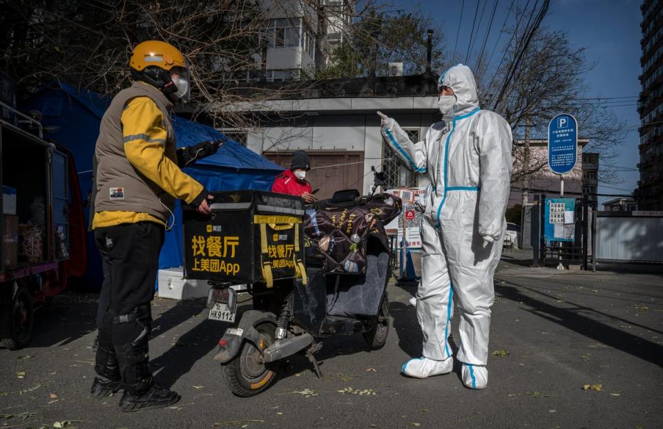 An epidemic control worker on patrol in Beijing (Getty Images)