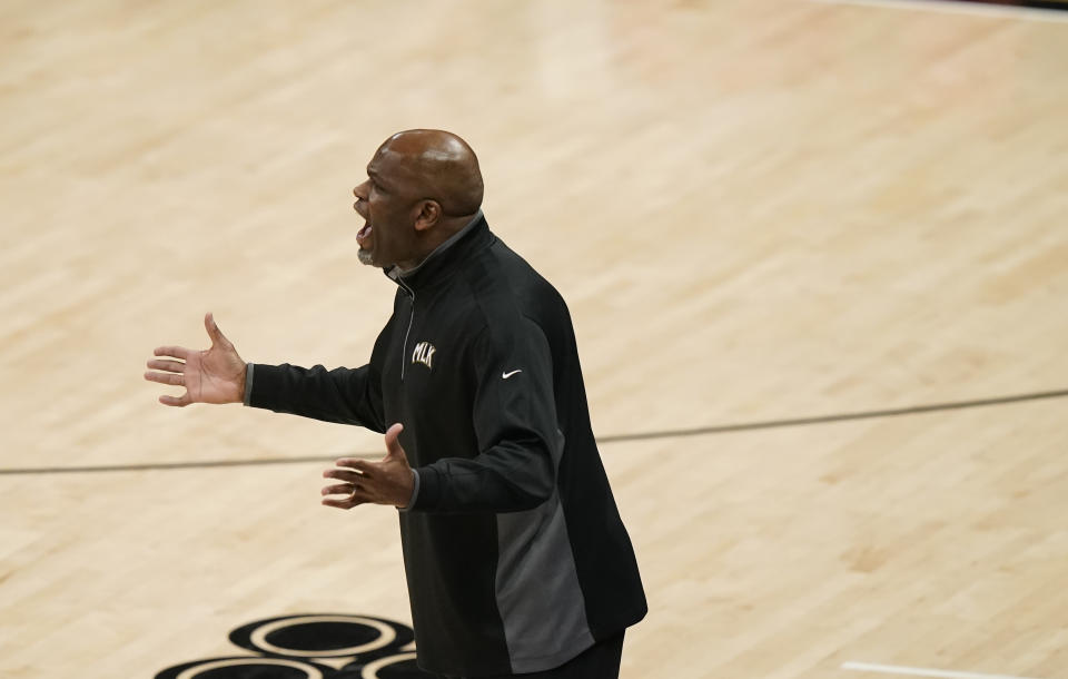 Atlanta Hawks coach Nate McMillan reacts to a play during the first half of Game 4 of a second-round NBA basketball playoff series against the Philadelphia 76ers, Monday, June 14, 2021, in Atlanta. (AP Photo/Brynn Anderson)