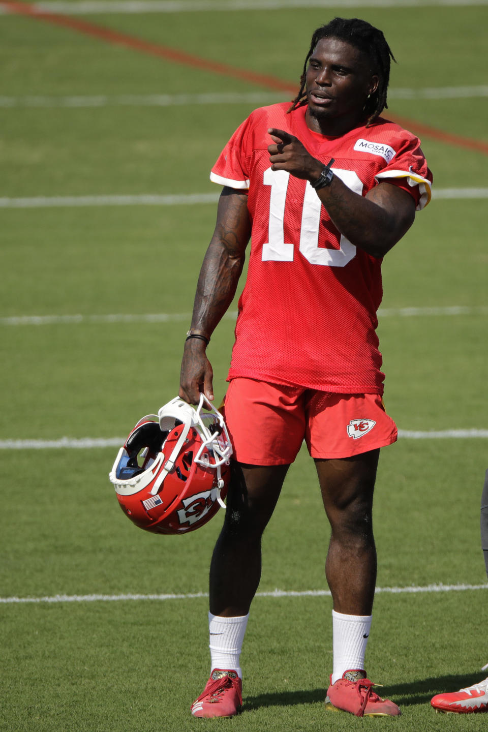 Kansas City Chiefs wide receiver Tyreek Hill motions to a teammate at NFL football training camp Saturday, July 27, 2019, in St. Joseph, Mo. (AP Photo/Charlie Riedel)