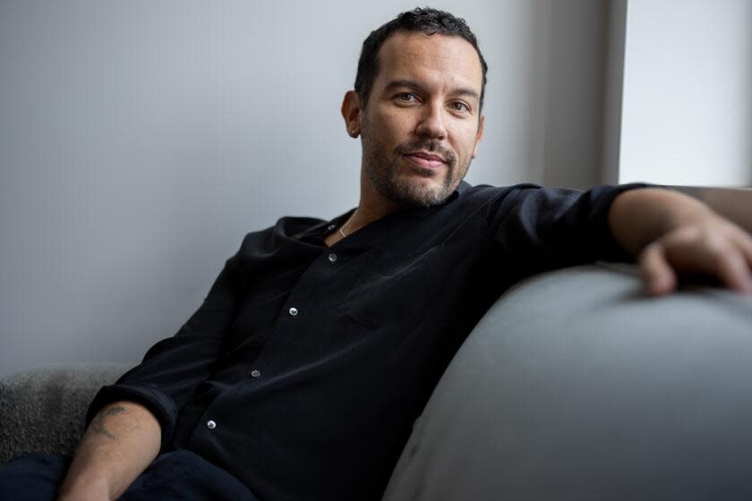 Los Angeles, CA - October 25: Novelist and UCLA professor, Justin Torres, is photographed in his Kaplan Hall office on campus, in Los Angeles, CA, Wednesday, Oct. 25, 2023. Torres has his second book, "Blackouts: A Novel," out this month. (Jay L. Clendenin / Los Angeles Times)