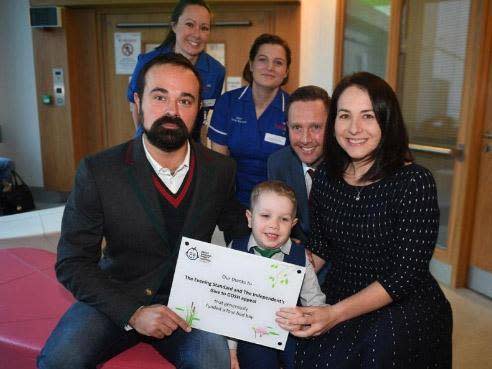 The Independent proprietor, Evgeny Lebedev, with Elliott Livingstone and parents Adrian and Candace