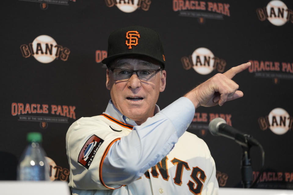 San Francisco Giants manager Bob Melvin gestures while talking about going down the slide inside the Coke bottle in left field during an introductory baseball news conference at Oracle Park in San Francisco, Wednesday, Oct. 25, 2023. (AP Photo/Eric Risberg)