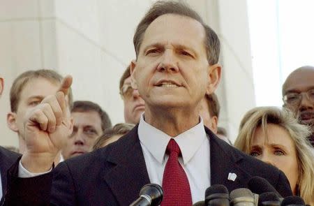 FILE PHOTO: Roy Moore faces the media after being removed from office in Montgomery, Alabama, U.S. November 13, 2003. REUTERS/Bob Ealum/File Photo
