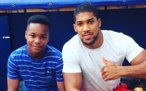 Jayden Moodie with his idol, World Heavyweight boxing champion Anthony Joshua - Credit: Twitter