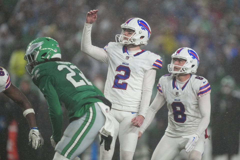 Buffalo Bills place-kicker Tyler Bass washes his field goal against the Philadelphia Eagles during overtime in an NFL football game Sunday, Nov. 26, 2023, in Philadelphia. (AP Photo/Matt Rourke)