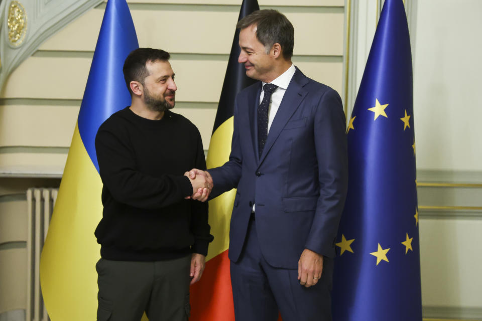 Ukraine's President Volodymyr Zelenskyy, left, is greeted by Belgium's Prime Minister Alexander De Croo prior to a meeting at the prime ministers office in Brussels, Wednesday, Oct. 11, 2023. (Yves Herman, Pool Photo via AP)