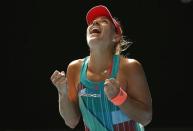 Germany's Angelique Kerber celebrates after winning her semi-final match against Britain's Johanna Konta at the Australian Open tennis tournament at Melbourne Park, Australia, January 28, 2016. REUTERS/Issei Kato