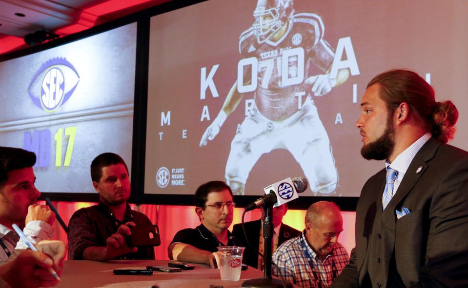 Texas A&M NCAA college football player Koda Martin speaks during the Southeastern Conference’s annual media gathering, Wednesday, July 12, 2017, in Hoover, Ala. (AP Photo/Butch Dill)