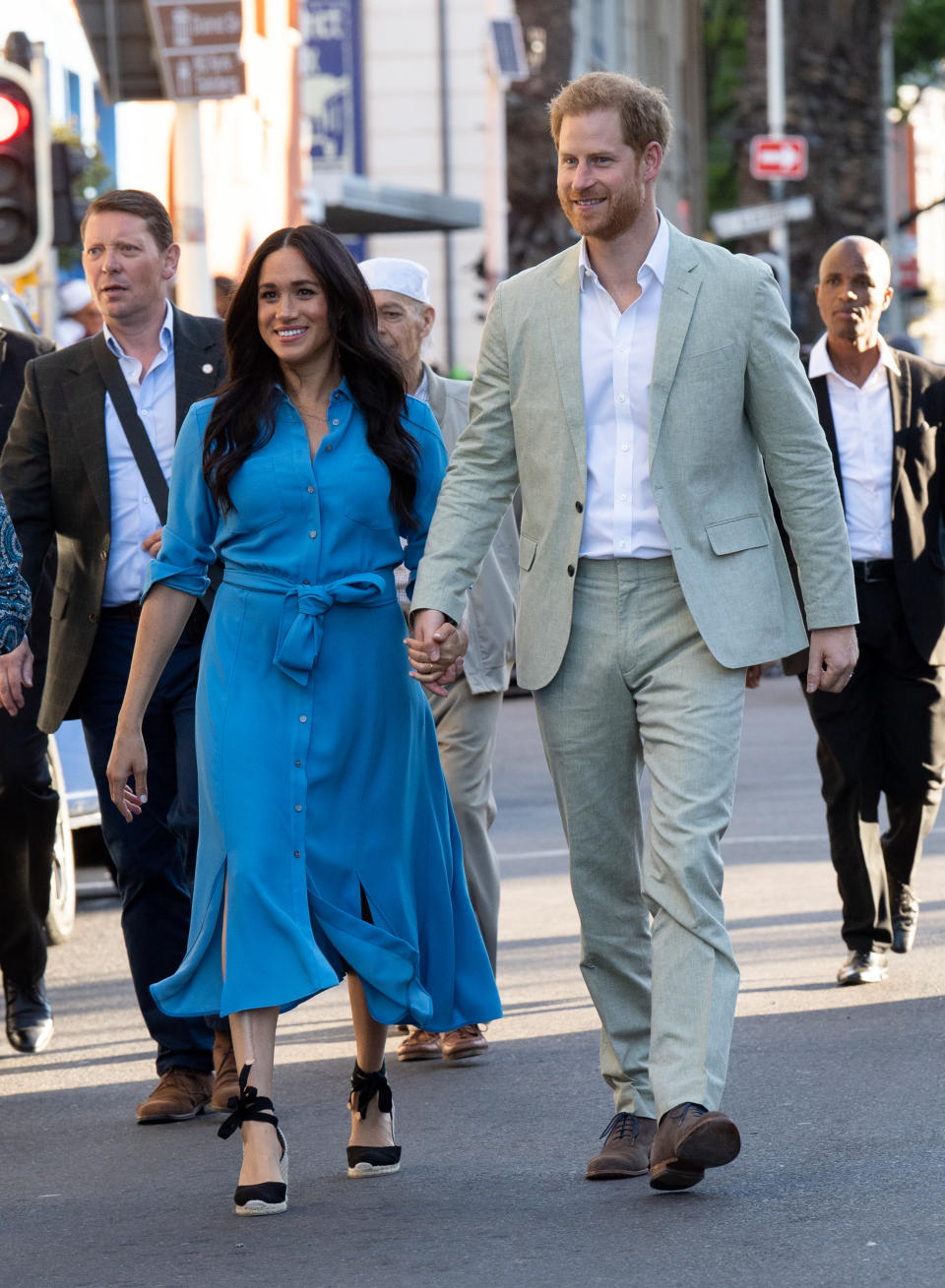 The Duke visited District 6 in Cape Town wearing a grey two-piece suit from J.Crew, a white button-down shirt and chocolate brown shoes. [Photo: Getty Images]