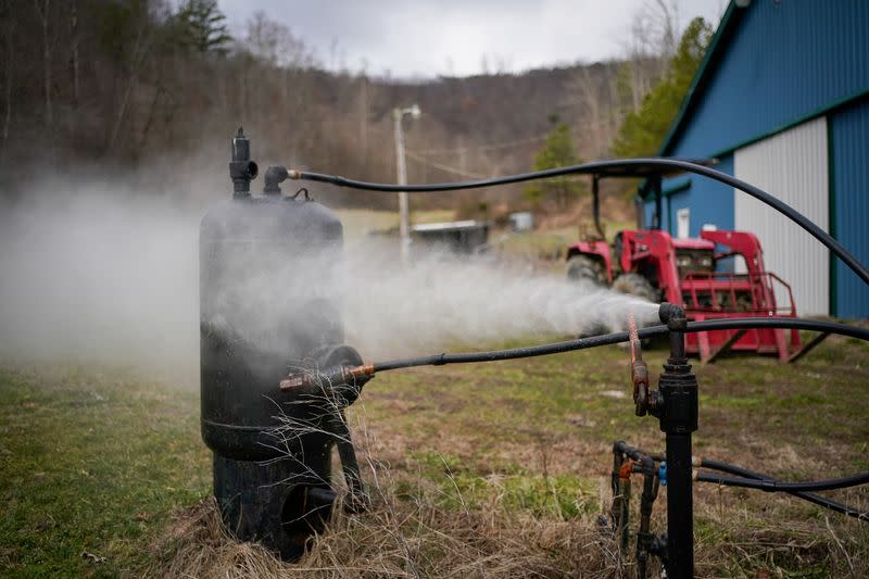 Pressure is released from a natural gas well on the property of Harlen Rowe in Salyersville