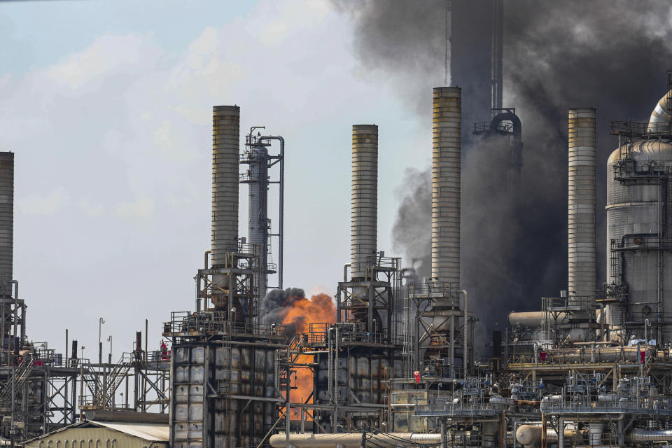 A fire burns at a Shell chemical facility in Deer Park, Friday, May 5, 2023, east of Houston. A chemical plant in the Houston area has caught fire, sending a huge plume of smoke into the sky. The Harris County Sheriff’s Office said Friday the fire was at a Shell USA Inc. facility in Deer Park, a suburb east of Houston. (Raquel Natalicchio/Houston Chronicle via AP)