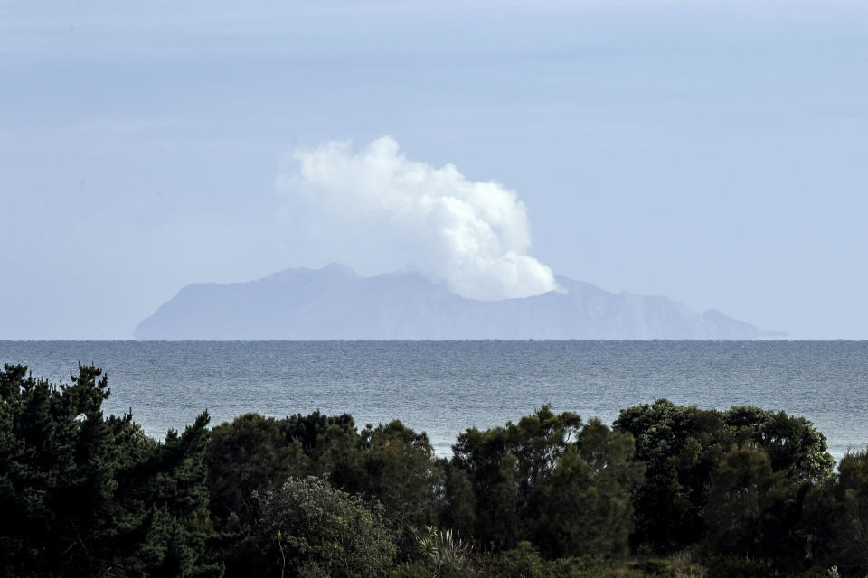 FILE - Plumes of steam rise above White Island off the coast of Whakatane, New Zealand, on Dec. 11, 2019, following a volcanic eruption on Dec. 9. Tourists received no health and safety warnings before they landed on New Zealand’s most active volcano ahead of a 2019 eruption that killed 22 people, a prosecutor said Tuesday, July 11, 2023. (AP Photo/Mark Baker, File)