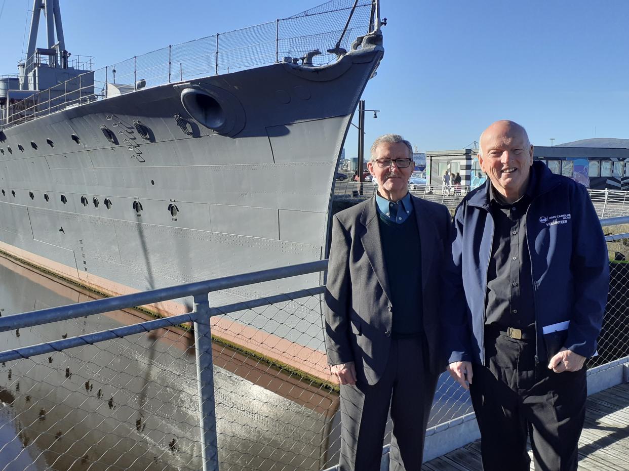 Grandfathers and HMS Caroline veterans Billy McConkey (left) and John Taylor in front of the ship (Declan Roughan/PA)