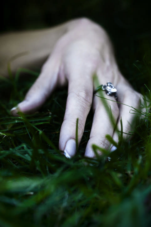 pale hand in grass