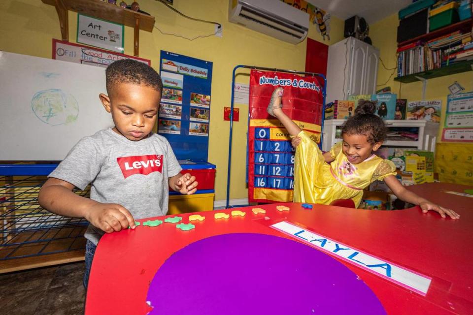 Student Tobeena Emedosi, 3, practices counting while his peer Layla Alston, 4, tests her flexibility after dinner at the Future Scholars’ Childcare and Transportation child care home in Grand Prairie on Thursday, March 14, 2024. Future Scholars’ is one of few programs in Tarrant County that provide 24/7 child care. Chris Torres/ctorres@star-telegram.com