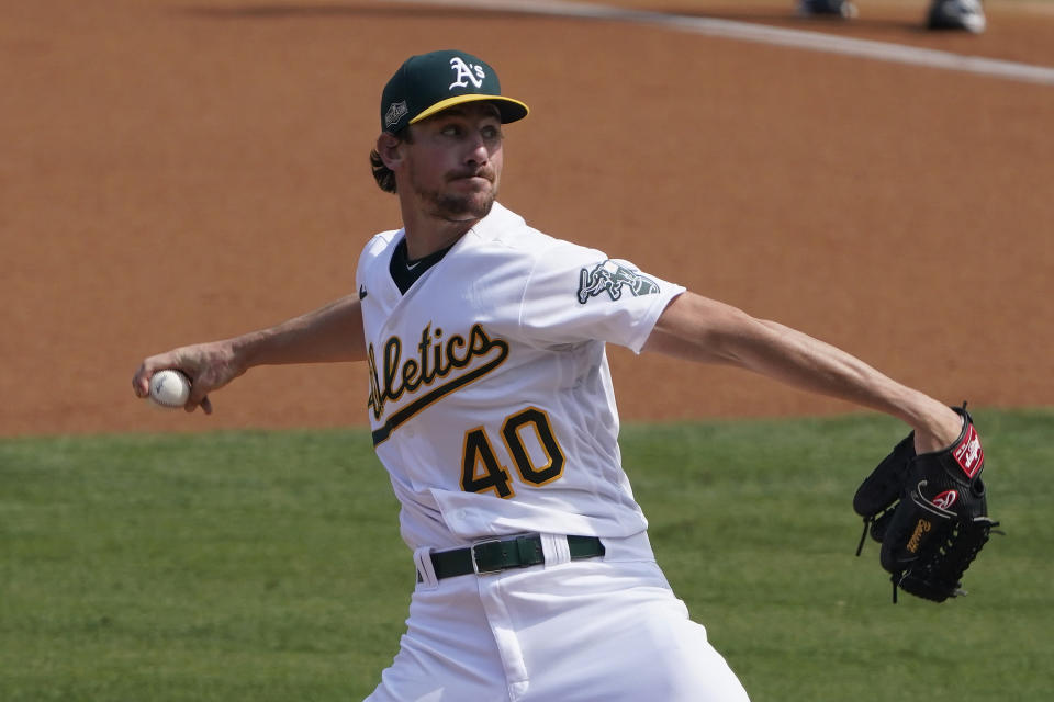 Oakland Athletics' Chris Bassitt (40) pitches against the Houston Astros during the first inning of Game 1 of a baseball American League Division Series in Los Angeles, Monday, Oct. 5, 2020. (AP Photo/Marcio Jose Sanchez)