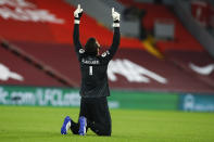 Liverpool's goalkeeper Alisson Becker reacts during the English Premier League soccer match between Liverpool and Arsenal at Anfield in Liverpool, England, Monday, Sept. 28, 2020. (Jason Cairnduff/Pool via AP)