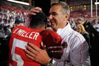 Head Coach Urban Meyer hugs quarterback Braxton Miller #5 of the Ohio State Buckeyes after the Buckeyes defeated the Nebraska Cornhuskers 63-38 at Ohio Stadium on October 6, 2012 in Columbus, Ohio. (Photo by Jamie Sabau/Getty Images)