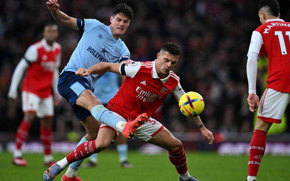 Christian Norgaard clears the ball from the patch Granit Xhaka - Arsenal need to get their left flank firing again with Gabriel Martinelli subdued - AFP