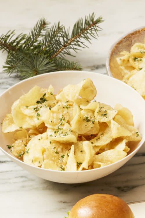 parmesan chive chips in a white bowl