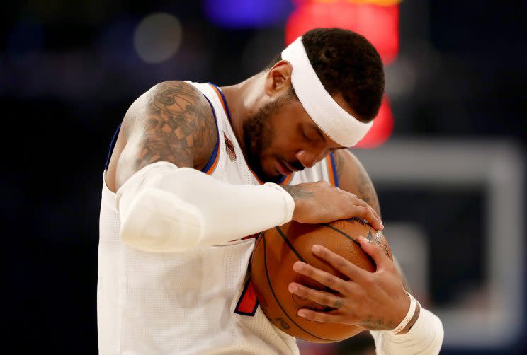 Carmelo Anthony tries to gaze upon his future, only to realize this isn't that kind of ball. (Getty)