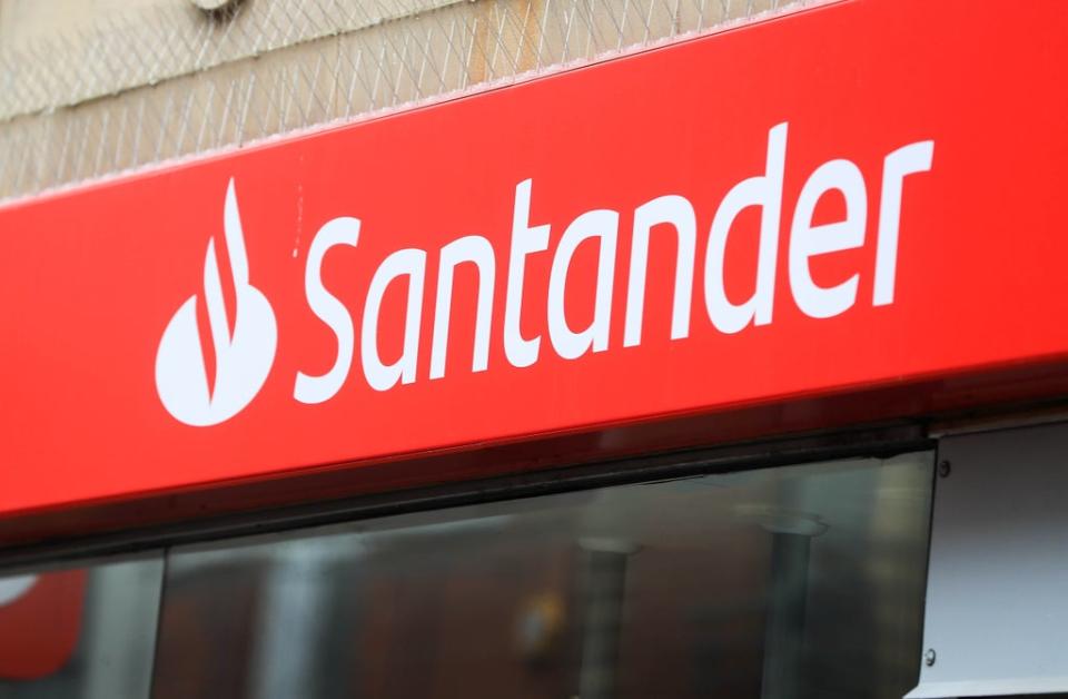 Santander is reducing its branch opening hours from July (PA) (PA Wire)