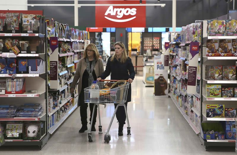 Shoppers pass an Argos concession at a Sainsbury's store in London, Britain October 11, 2016. REUTERS/Neil Hall