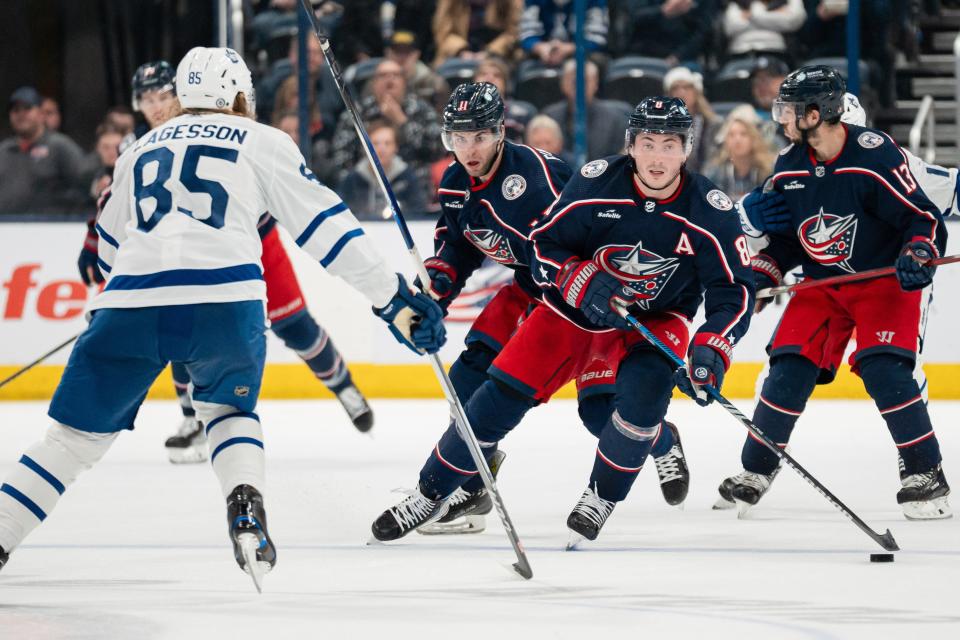 Dec 23, 2023; Columbus, Ohio, USA;
Columbus Blue Jackets defenseman Zach Werenski (8) skates down the rink against Toronto Maple Leafs defenseman William Lagesson (85) during the third period of their game on Saturday, Dec. 23, 2023 at Nationwide Arena.