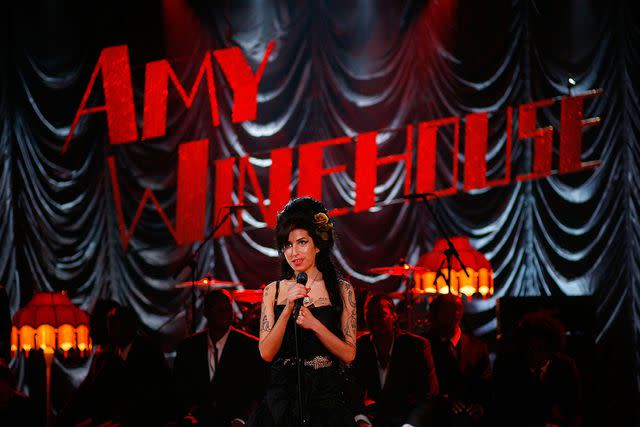<p>Peter Macdiarmid/Getty Images</p> Amy Winehouse performing at Riverside Studios in London for the 50th Grammy Awards in February 2008