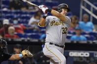 Pittsburgh Pirates' Yoshi Tsutsugo watches a single during the ninth inning of the team's baseball game against the Miami Marlins, Saturday, Sept. 18, 2021, in Miami. The Pirates won 6-3. (AP Photo/Marta Lavandier)