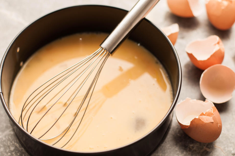 scrambled eggs in a pan waiting to be cooked