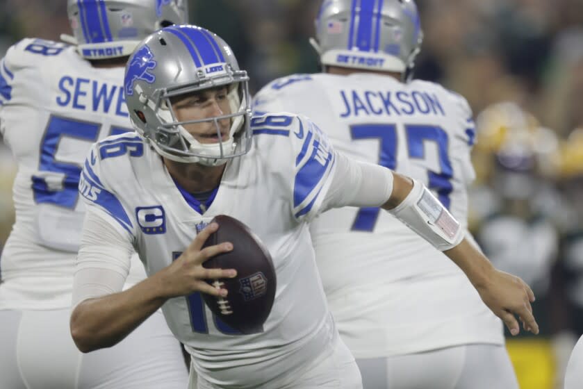 Detroit Lions' Jared Goff scrambles during the first half of an NFL football game against the Green Bay Packers Monday, Sept. 20, 2021, in Green Bay, Wis. (AP Photo/Matt Ludtke)