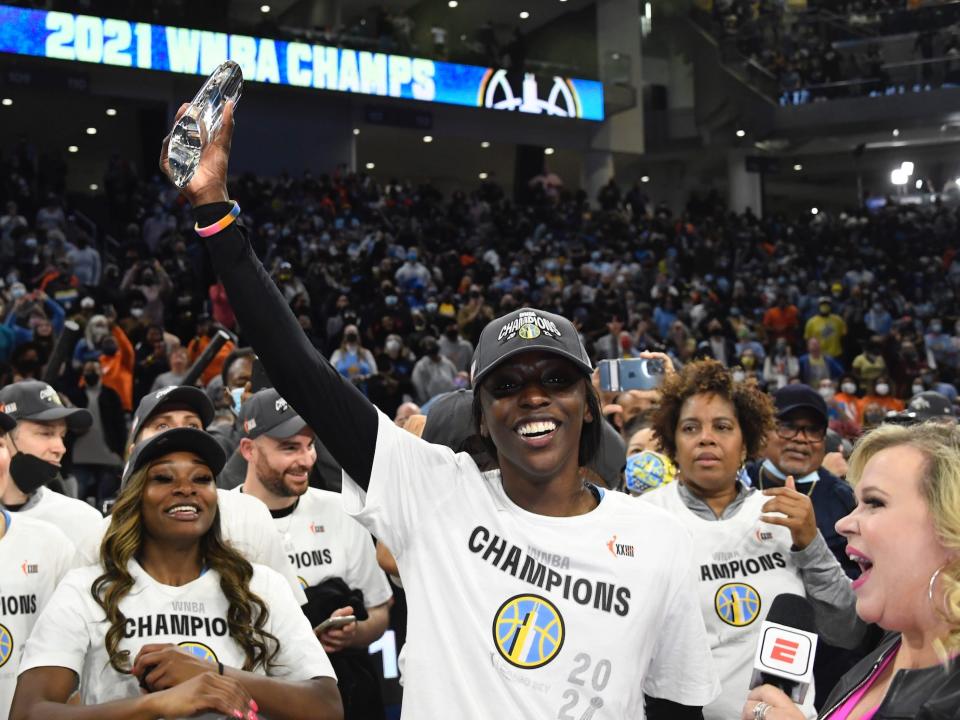 Kahleah Copper holds her WNBA Finals MVP award in the air.