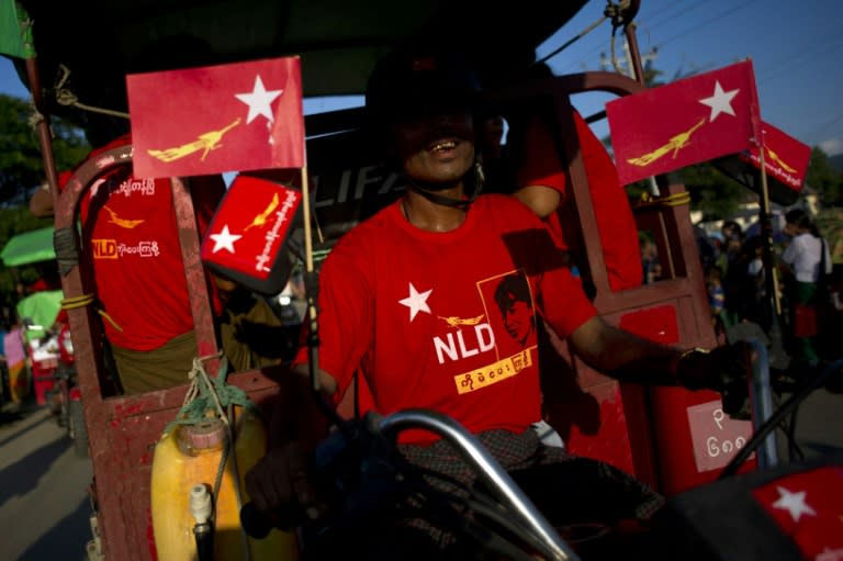 An NLD supporter leaves after attending a rally and speech by National League for Democracy chairperson Aung San Suu Kyi, on the outskirts of Winemaw town near the state capital Myitkyina, Kachin state, on October 2, 2015