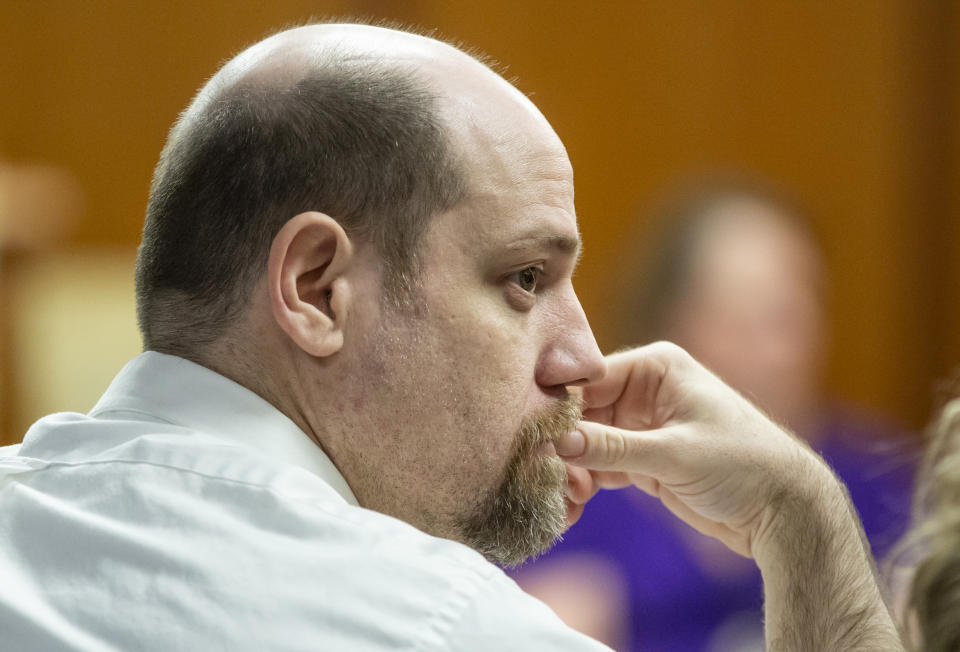 Stephen Bodine looks at members of the jury Wednesday, Oct. 24, 2018, in Wichita, Kan., while it was announced he was guilty on all charges in connection with the murder of three-year-old Evan Brewer. (Travis Heying/The Wichita Eagle via AP)