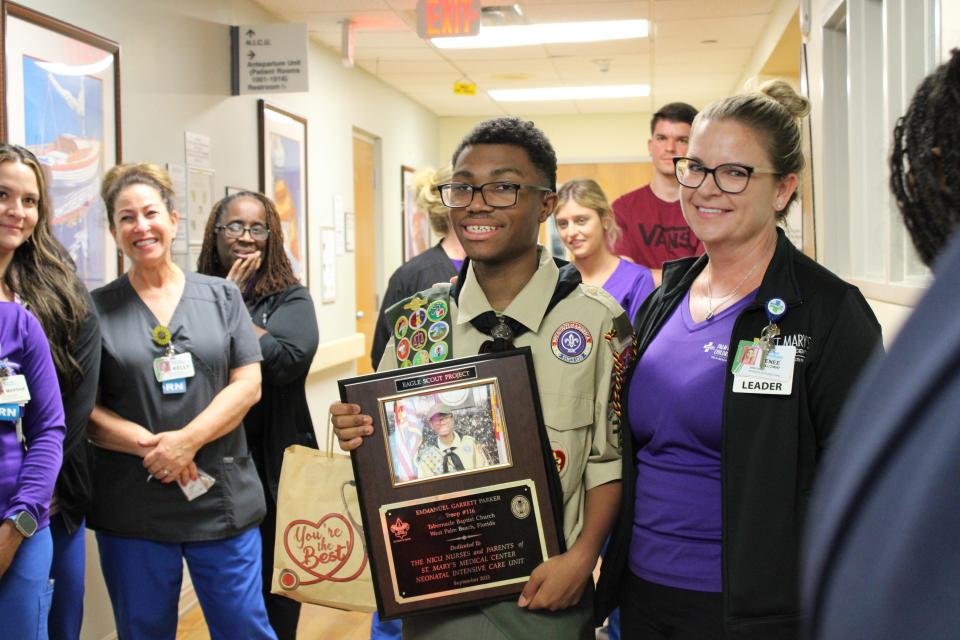 Emmanuel "Manny" Parker distributes care bags for his Eagle Scout community service project to nurses and families in the neonatal intensive-care unit at St Mary's Medical Center in West Palm Beach on Friday, Sept. 15, 2023.