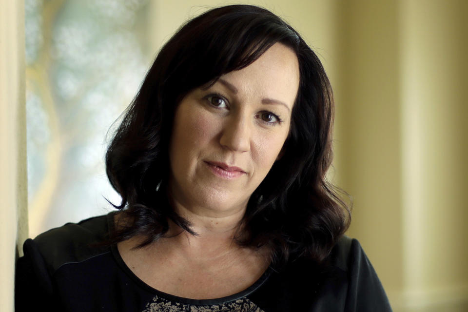 FILE - In this Aug. 9, 2018 file photo, MJ Hegar poses for a portrait at her home in Round Rock, Texas. Hegar of says she's running for U.S. Senate in 2020 against Republican incumbent John Cornyn. Hegar's announcement Tuesday, April 23, 2019, makes her the first Democrat to jump in the race against Cornyn, who's been in the Senate since 2002 and until this year was the No. 2 Republican in the chamber. (AP Photo/Eric Gay, File)
